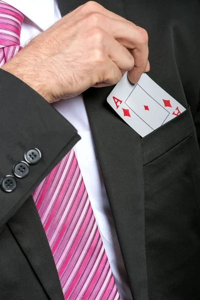 Businessman pulling out his pocket aces — Stock Photo, Image