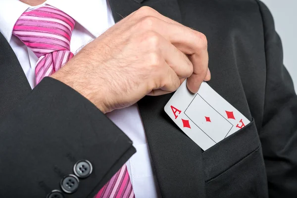 Businessman pulling out aces — Stock Photo, Image