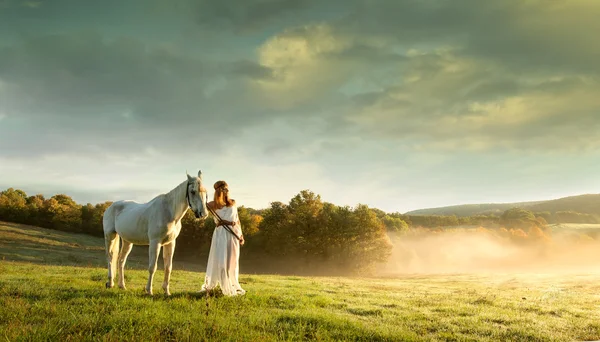 Women with white horse — Stock Photo, Image