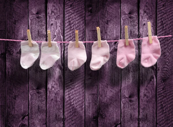 3 pairs pink socks on the clothesline — Stock Photo, Image