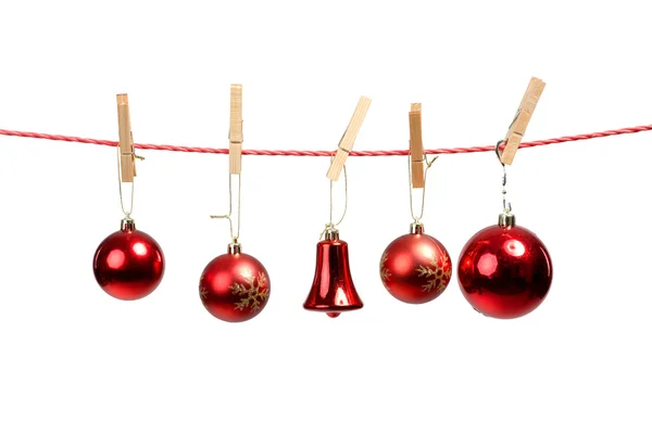 Christmas tree ornaments on the clothesline — Stock Photo, Image