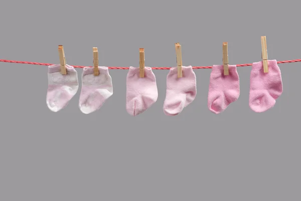 Baby girl socks on the clothesline — Stock Photo, Image