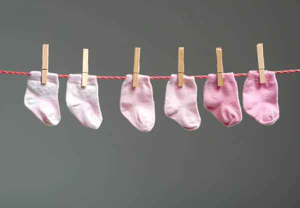 Baby girl socks on the clothesline — Stock Photo, Image