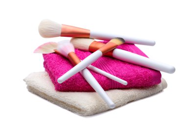 Makeup Brushes on white-pink towel clipart
