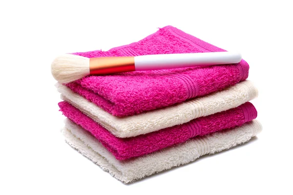 Brushes for make-up on pink, white towel — Stock Photo, Image