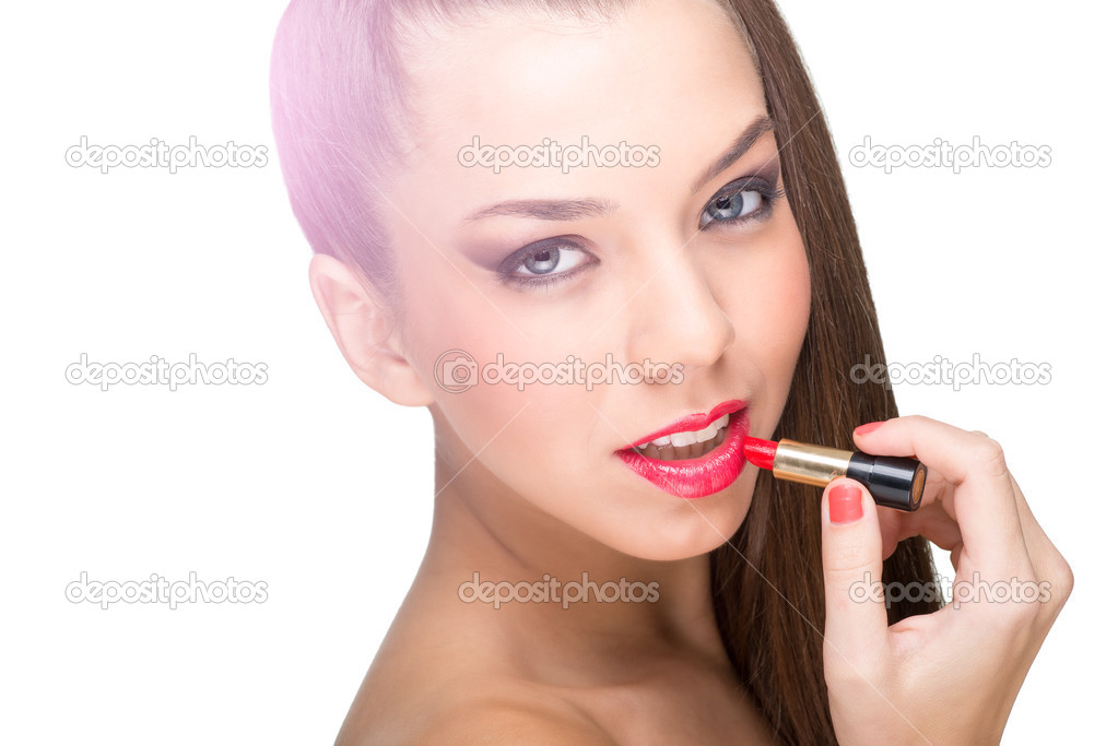 Woman using a red lipstick