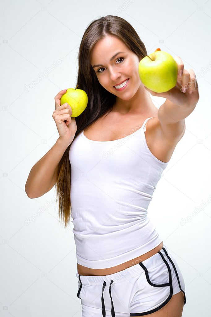 Eat healthily - Beautiful woman shows the apples