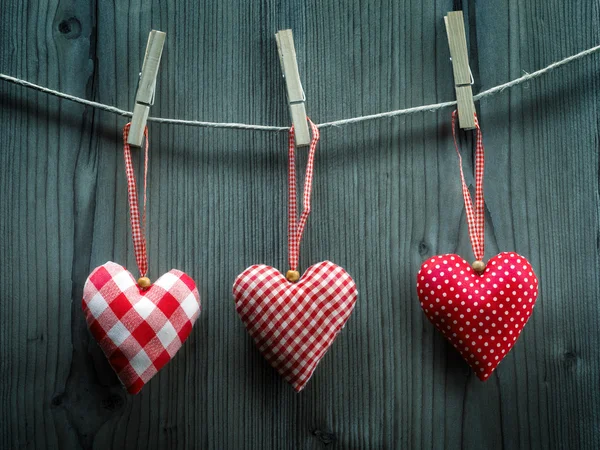 Valentine's Day wallpaper - Textile hearts hanging on the rope — Stock Photo, Image