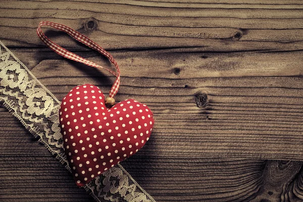 Dotted Fabric heart with lace wood background — Stock Photo, Image