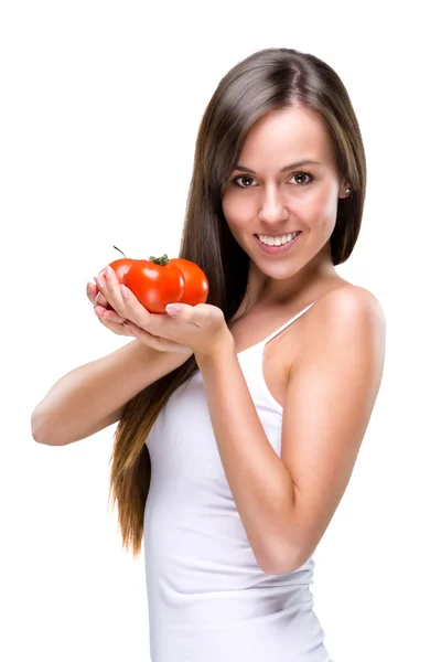 Frau in der Hand einer Tomate — Stockfoto