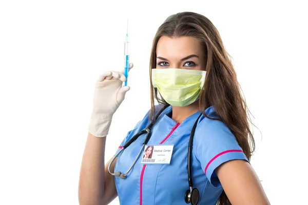 Young pretty nurse in mask mouth and syringe — Stock Photo, Image