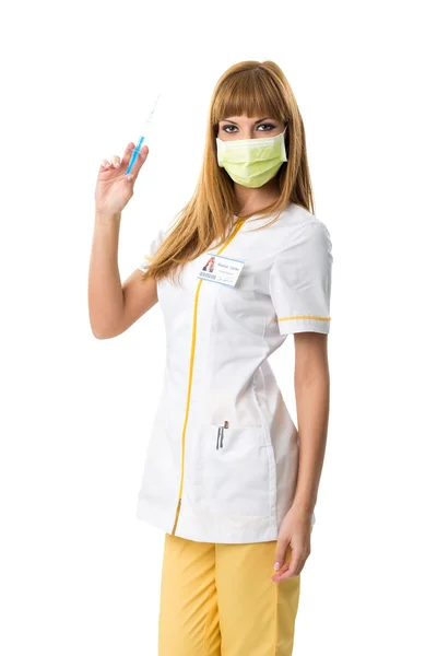 Pretty young nurse in mouth mask with injection — Stock Photo, Image