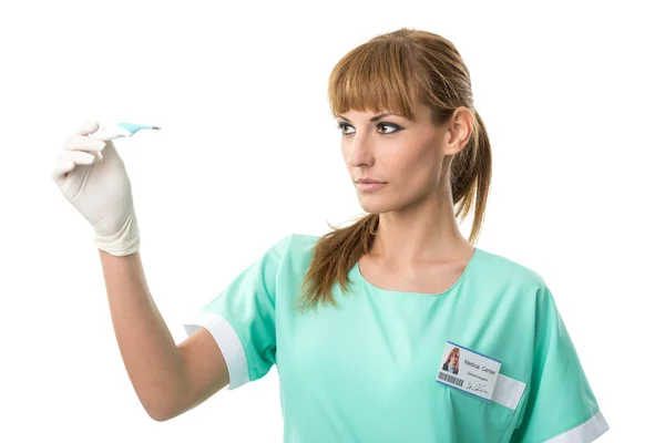 Nurse watching thermometer — Stock Photo, Image