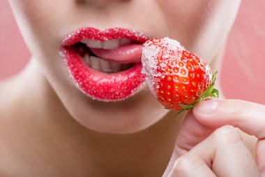 Female red lips lick strawberry clipart