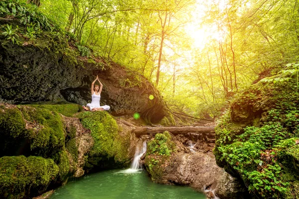 Woman practices yoga — Stock Photo, Image