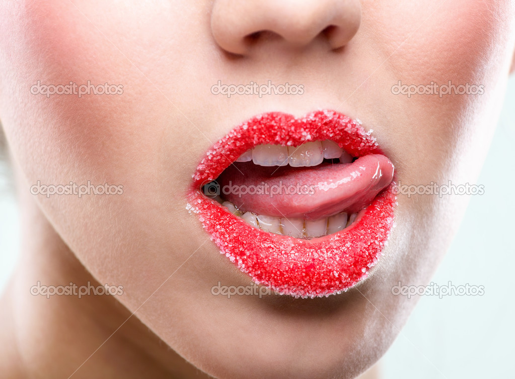 Female lips full with sugar