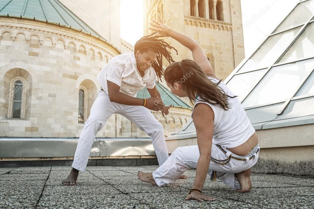 Capoeira partners performing kicks Stock Photo by ©Geribody 48479663