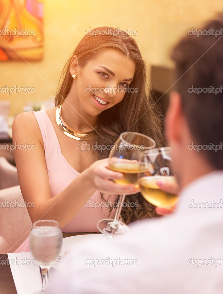 Loving couple toasting a restaurant