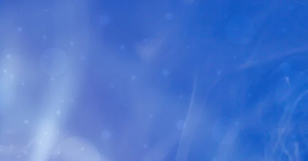 Mavi arkaplanda soyut ışık ve bokeh