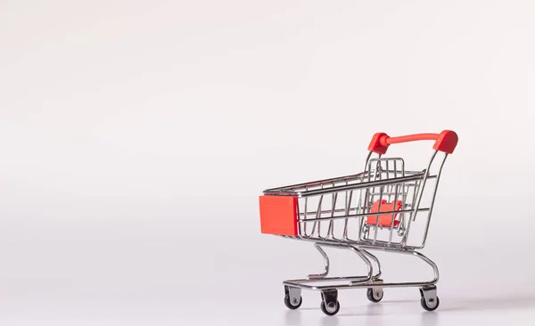 Empty small shopping cart on white background and copy space