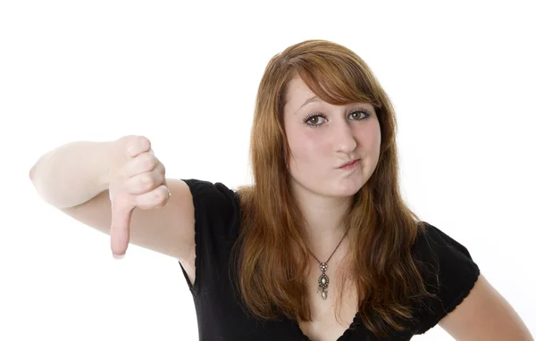 Young woman showing thumbs down Royalty Free Stock Photos