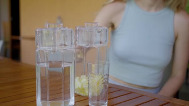 Woman Pours Tonic Drink Lemon Honey Decanter Glass Slow Motion — ストック動画