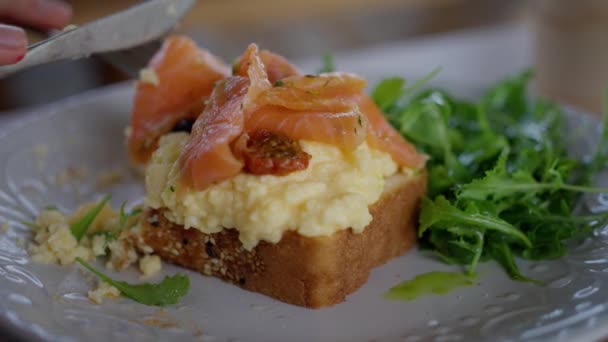 Woman Cafe Eats Scramble Eggs Bread Salmon Close Slow Motion — Stock Video