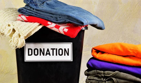A donation box with clothes. Help to those in need. The concept of charity.