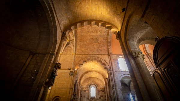 Interior of the Church of San Isidoro de Len in Spain in Romanesque style, with overhead lighting and a cozy atmosphere. Architecture, religion, silence and recollection.