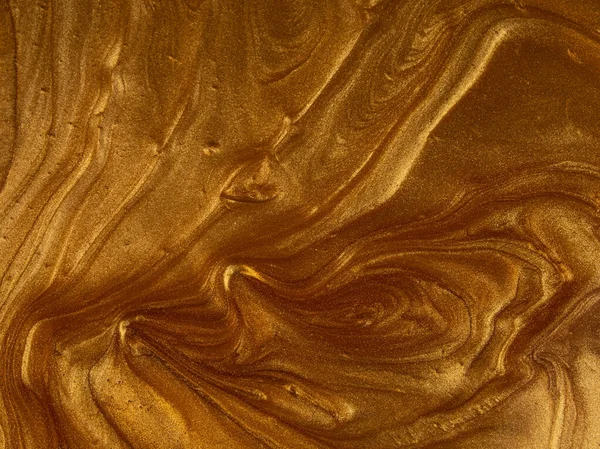 Light, soft, shiny gold paint texture simulating a watery, wavy, marbled texture perfect for backgrounds and graphic resources
