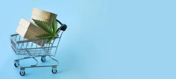 Kenevir mağazası online alışveriş. Hızlı CBD teslimatı. Alışveriş arabasında marihuana yaprağı ve pankart.