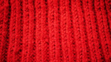 Kırmızı yün örülmüş arka plan. El yapımı tekstil deseni 