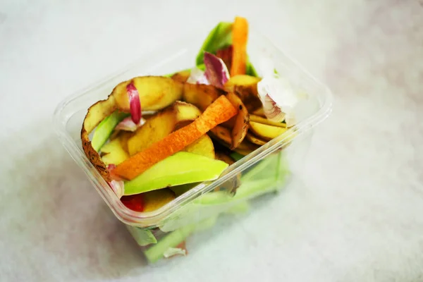 Food waste in container. Organic garbage composting concept. Sustainable lifestyle.