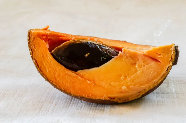 Slice Mamey Sapote Fruit Seed Resting White Surface — Φωτογραφία Αρχείου