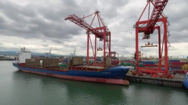 Dublin, Ireland- July 7, 2022: A container ship getting loaded in Dublin port.