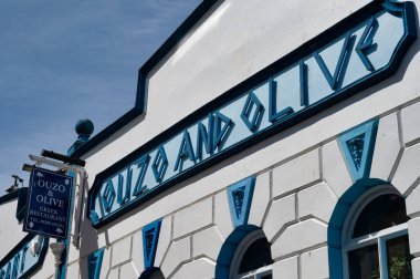 Caernarfon, UK- July 11, 2022: Ouzo and Olive Greek Restaurant in Caernarfon in North Wales