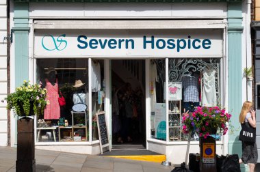 Shrewsbury, UK-  July 14, 2022: Severn Hospice shop in Shrewsbury, Engalnd. clipart