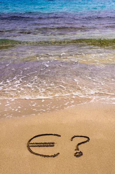 Euro sign and question mark in the sand — Stock Photo, Image