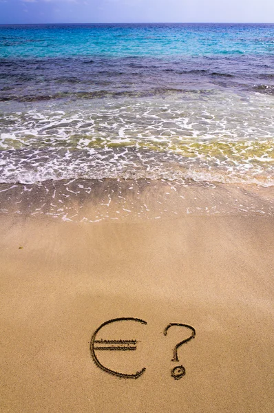 Euro sign and question mark in the sand — Stock Photo, Image