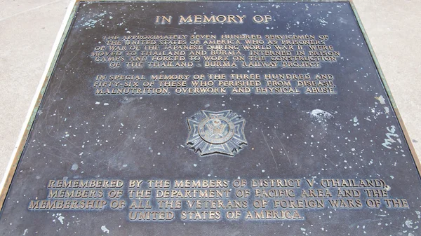 Kanchanaburi, Thailand - May 23, 2014: Memorial stone in memory of the war prisoners who lost their lives during the construction of the Death Railway over River Kwai.The bridge is famous due to the m