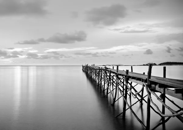 Black and white photography of a beach wooden pier Stock Picture