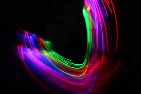 long exposure, painting light with colorful lights in a dark room