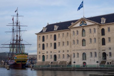 22 December 2021, Amsterdam, Netherlands,  Sunset  image of the Het Scheepvaartmuseum (National Maritime Museum) during the winter holidays, Christmas, and New Year