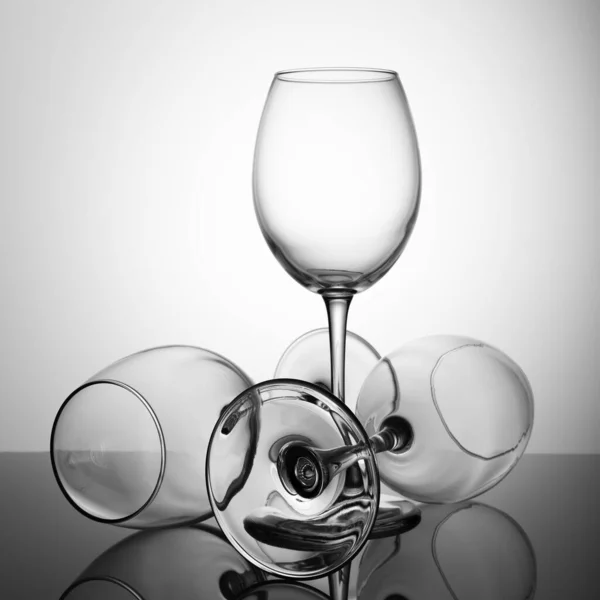 Set Empty Glasses Black Table Reflection Black White — Stock Photo, Image