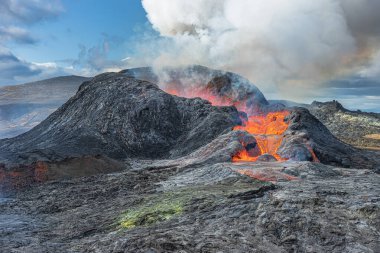 Volcanic crater after eruption. Volcanic landscape in Iceland on the Reykjanes Peninsula. Active volcano with little lava. Lava flow on the inside of the volcano. cooled magma around the crater