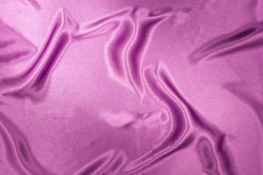 Parlak, güzel, ipek kumaş. Leylak renginde soyut arkaplan.