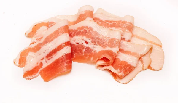 Bacon cut into strips on a white background — Stock Photo, Image