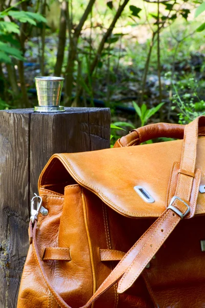 Carpetbag and collapsible cup — Stock Photo, Image