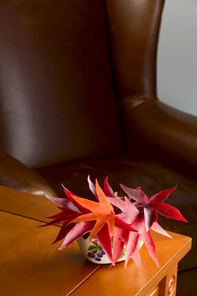 Ceramic vase with autumn leaves — Stock Photo, Image