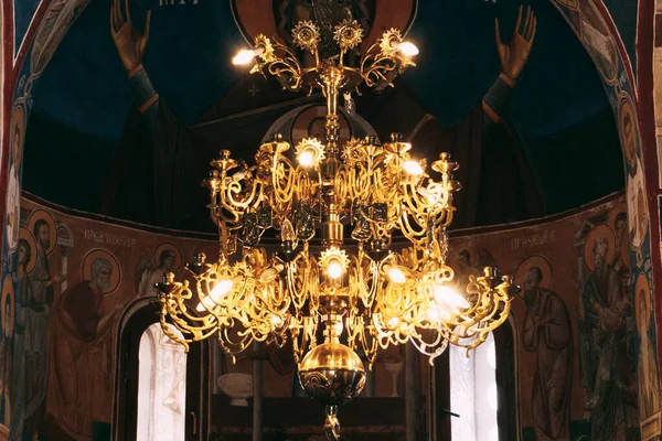Chandelier in the Ostrog monastery against the background of icons. Montenegro — Stock Photo, Image